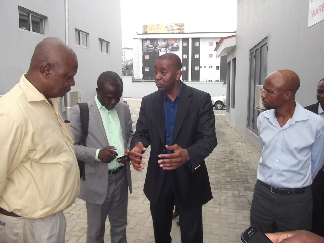 Ademola Ade-Ojo (3rd from left), making a point, while conducting journalists round the new JAC facility at Ikaja, Lagos, recently